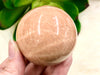 Peach Moonstone Sphere 53mm QT - Heart Chakra & Solar Plexus Chakra