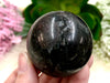 Garnet in Arfvedsonite 44 mm Sphere WN - Throat & Root Chakra Stone