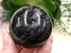 Garnet in Arfvedsonite 43 mmSphere WJ - Throat & Root Chakra Stone