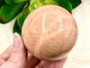 Peach Moonstone Sphere 53mm QT - Heart Chakra & Solar Plexus Chakra