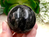 Garnet in Arfvedsonite 43 mmSphere WJ - Throat & Root Chakra Stone